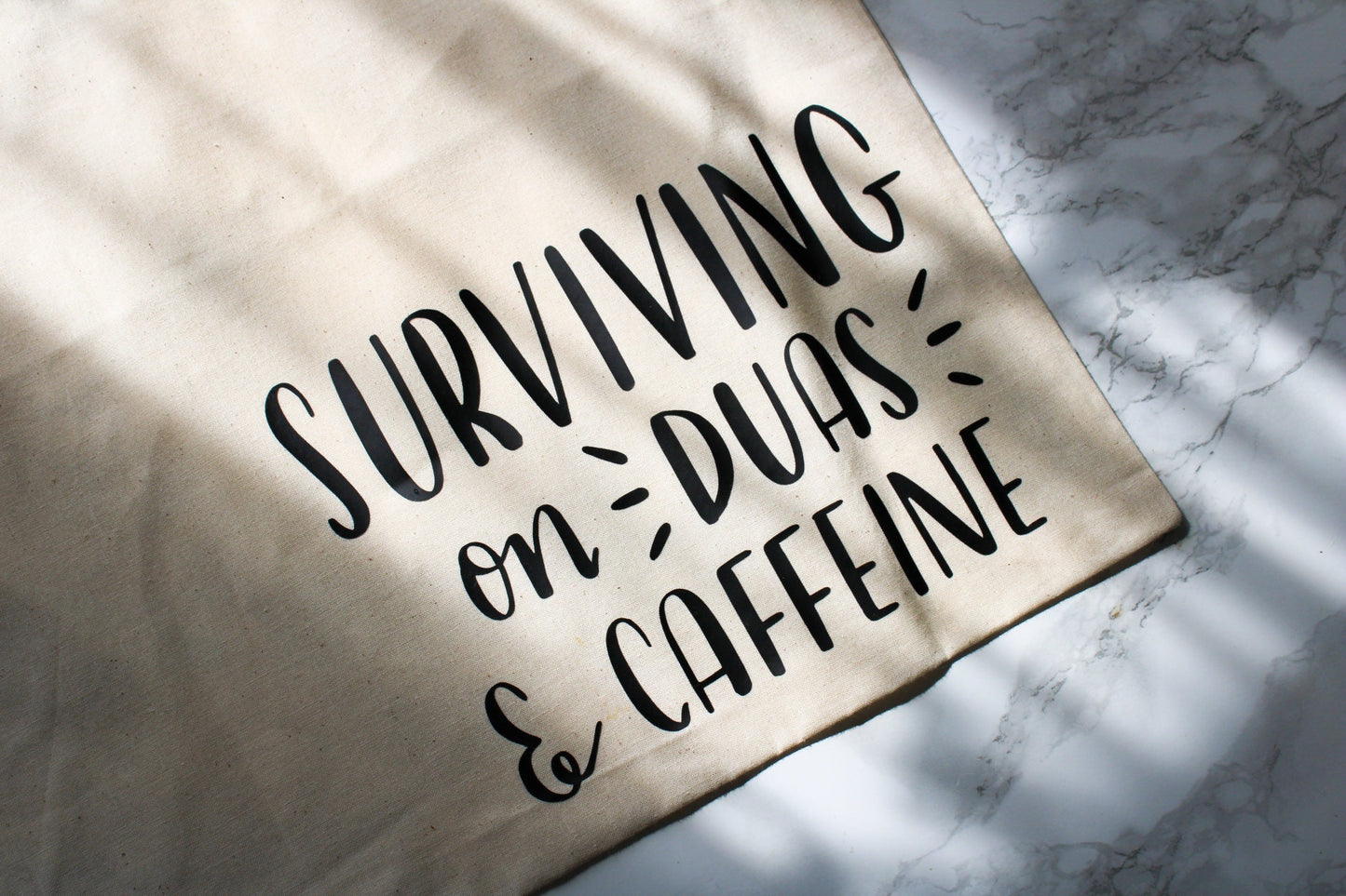 surviving on duas and caffeine | tote bag